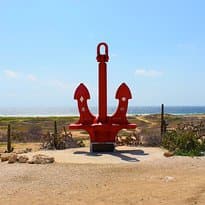 The "Anchor In Memory Of All Seamen" welcomes you triumphantly to the Seroe Colorado neighborhoo