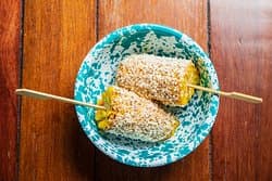 Elote. Grilled Corn, topped with chipotle mayo and queso fresco.