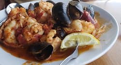SEAFOOD FRA DIAVOLO: Lobster tail, shrimp, scallops, mussels, fresh fish in a spicy marinara sauce over linguine.