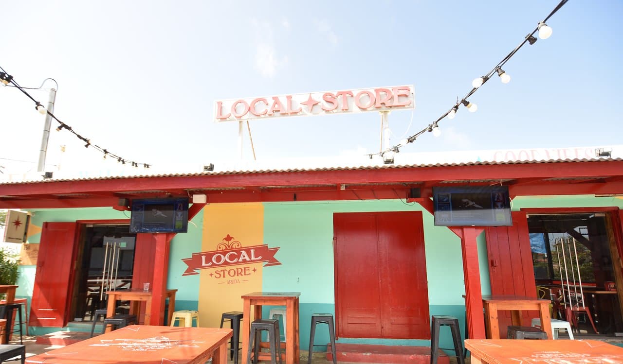 Front view of Local Store, located on the Palm Beach main road between the hotel area and central Noord.