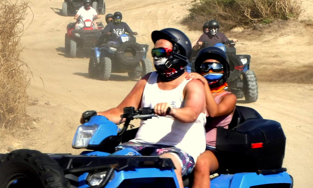 ATV guided tour. Bandanas available for sale.