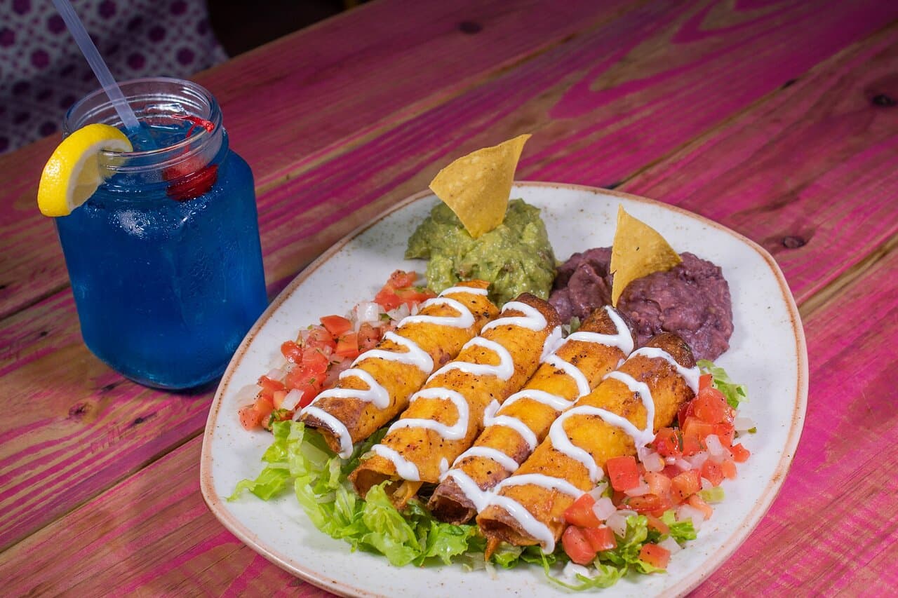 Chicken Flautas
Four crispy corn tortillas filled with shredded chicken topped with lettuce, sour cream, pico de gallo, guacamole and beans