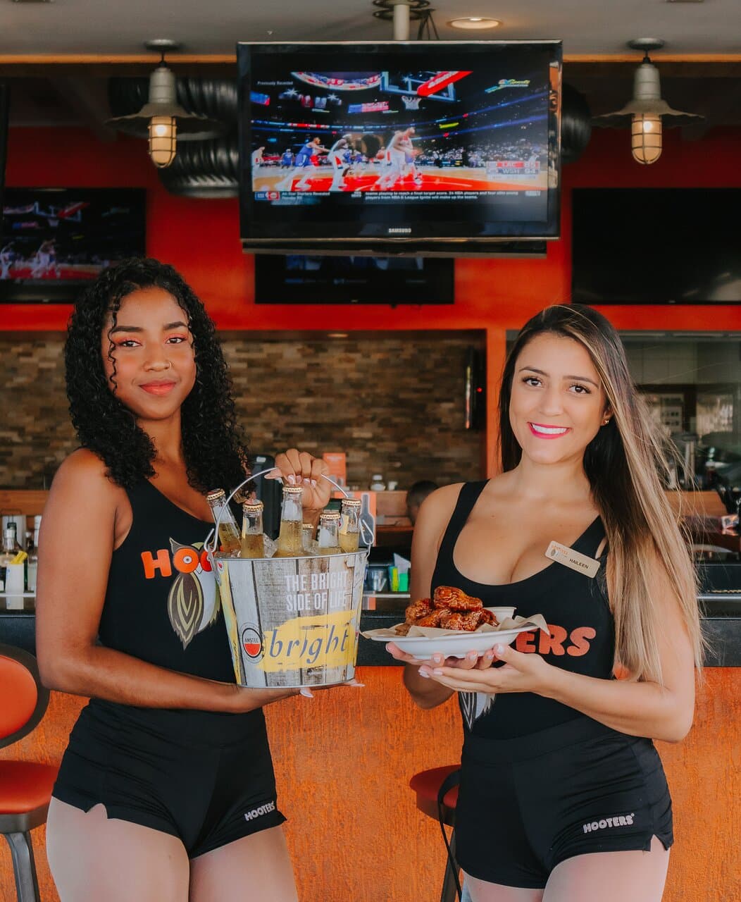 The best combination ever... wings, beer and our Hooters girls.