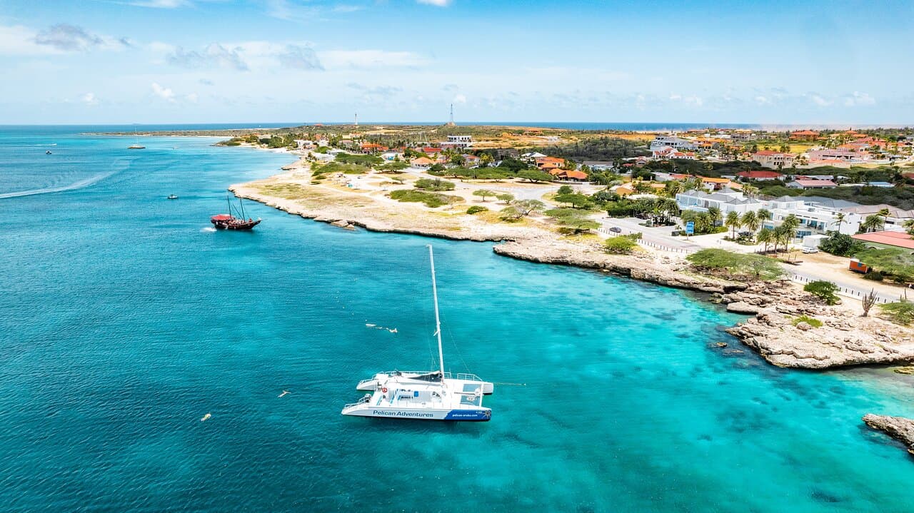 Sail the turquoise waters of Aruba and explore hidden gems with Pelican Adventures!