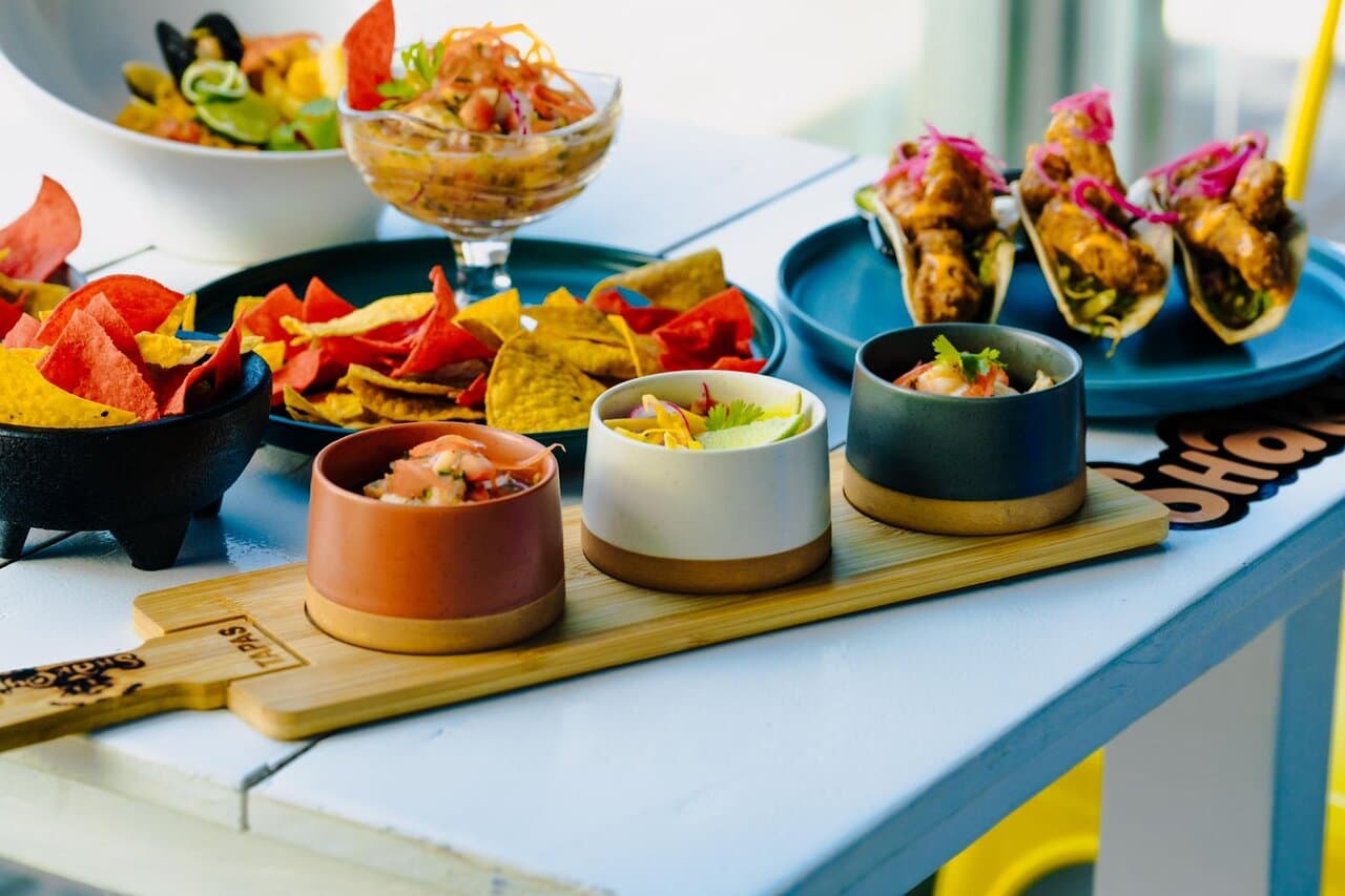 A spread of assorted tapas and tacos, perfect for sharing with friends.