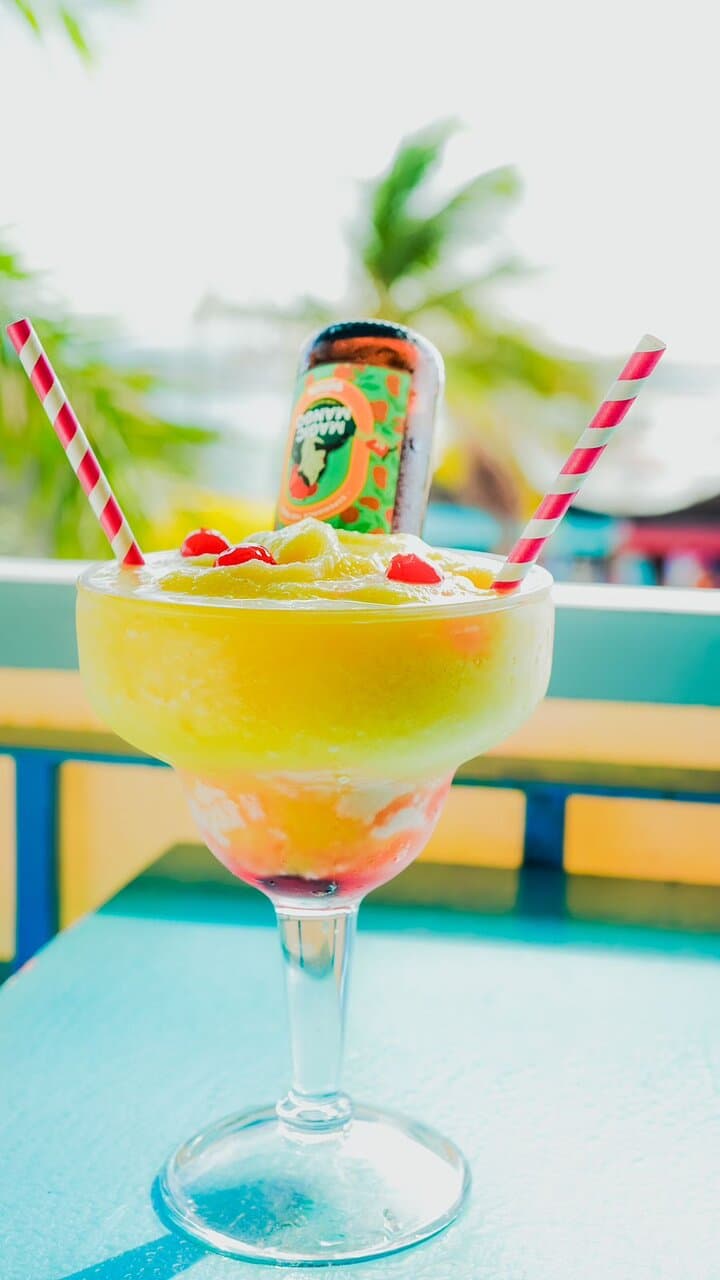 A refreshing frozen cocktail crowned with a splash of local beer for a unique tropical twist.