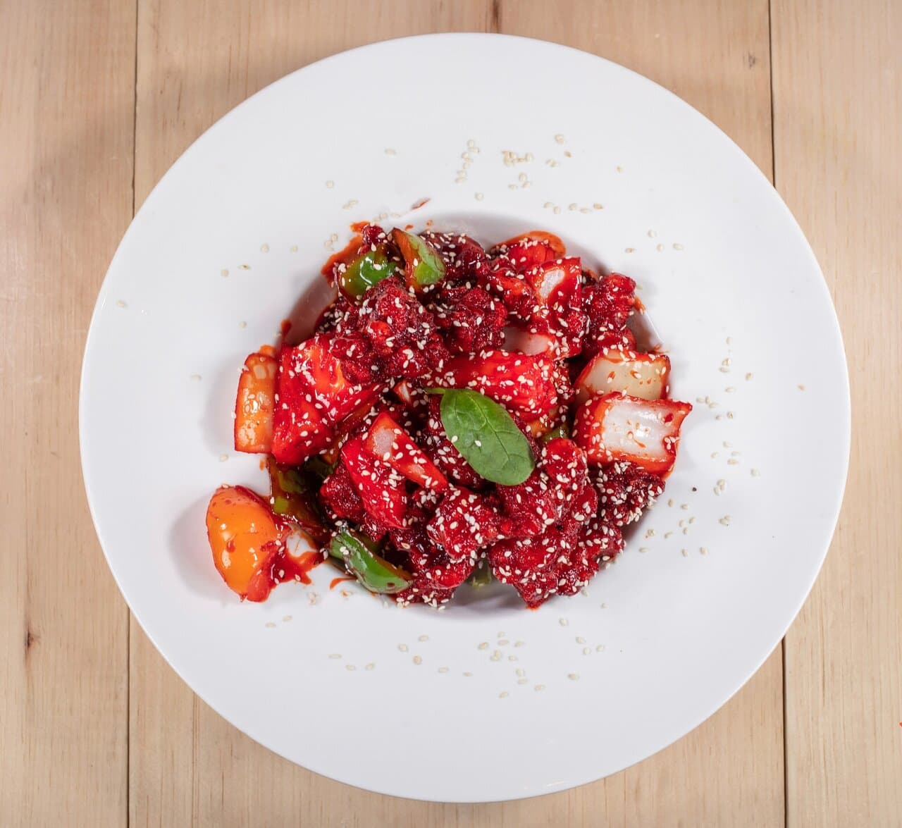 General tao chicken ( fried pieces of chicken tossed with vegetables and pineapple in a sweet and sour sauce. Served with rice)