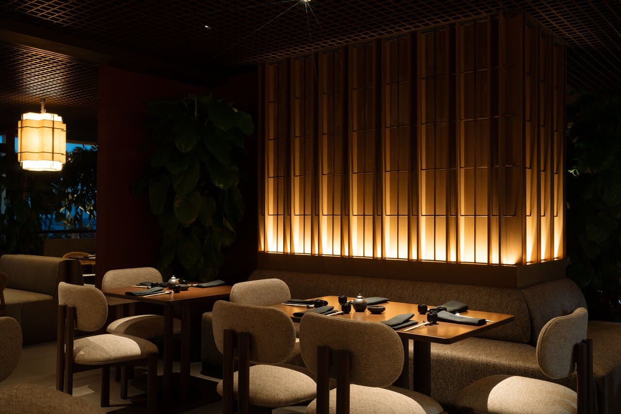 A warm, intimate dining setting at ShinSen designed for a refined evening experience.