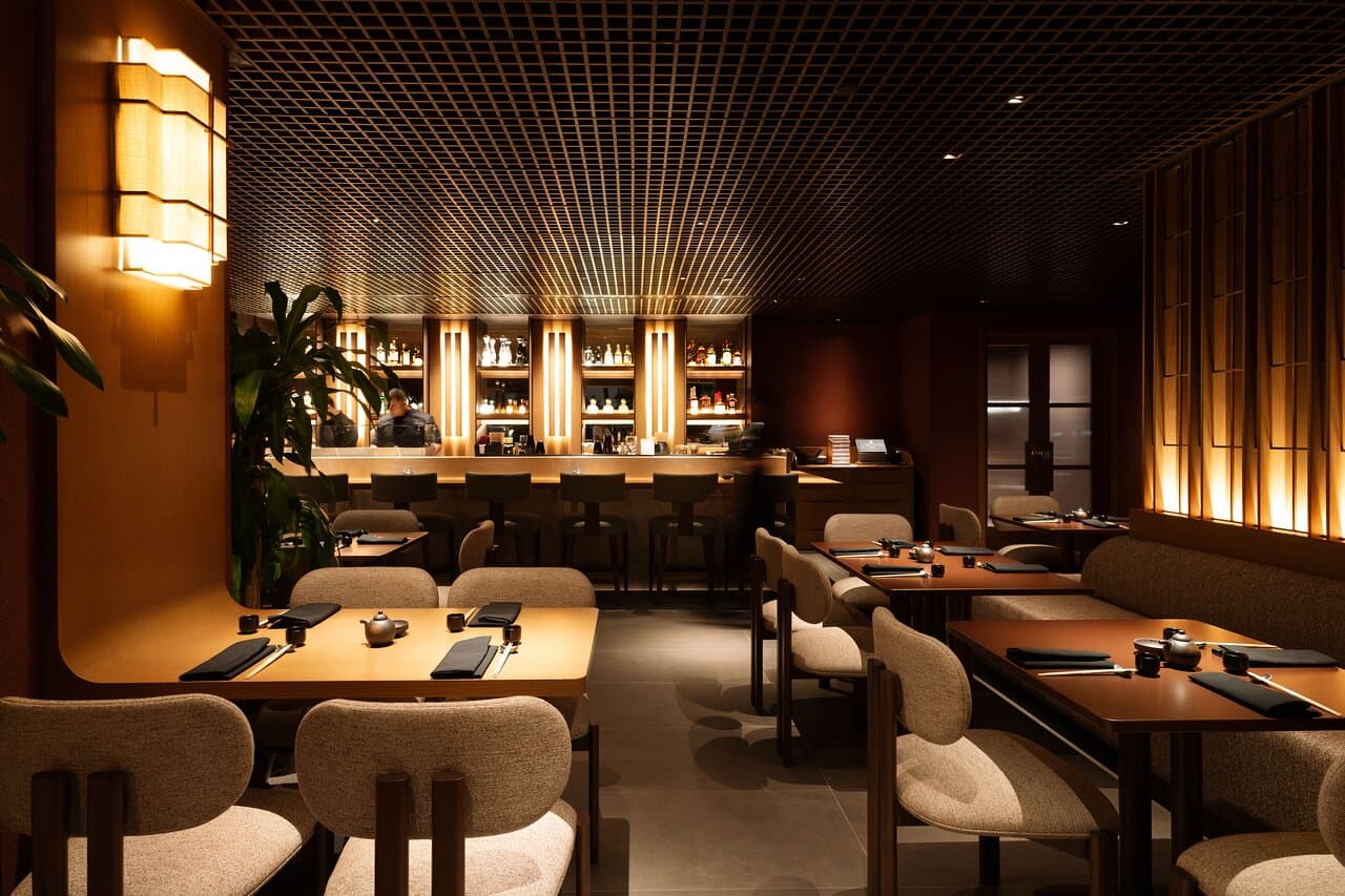Experience ShinSen’s refined ambiance as chefs bring their culinary artistry to life behind the illuminated bar.