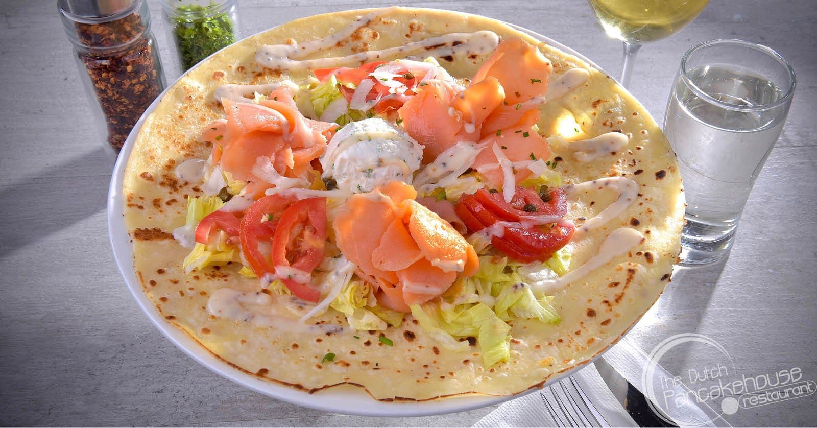 Norway - Smoked salmon served with lettuce, tomatoes, onions, capers & cream cheese