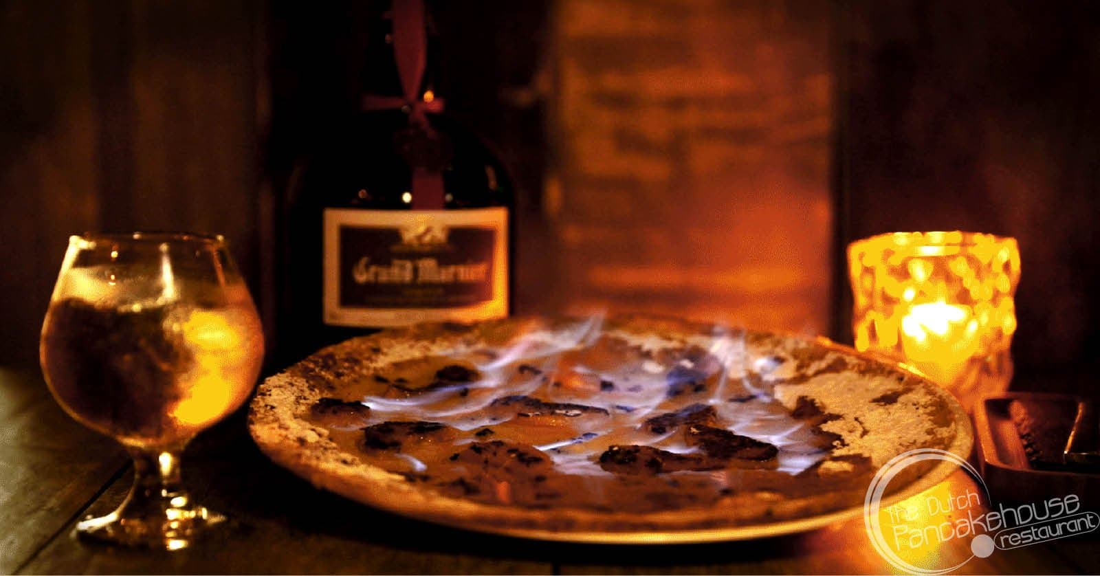 Peach on the beach - Peaches, powdered sugar & Grand Marnier flambé