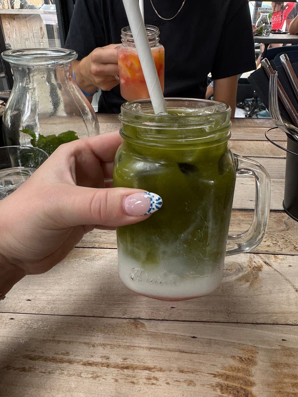 iced matcha made with coconut milk and raspberry syrup!