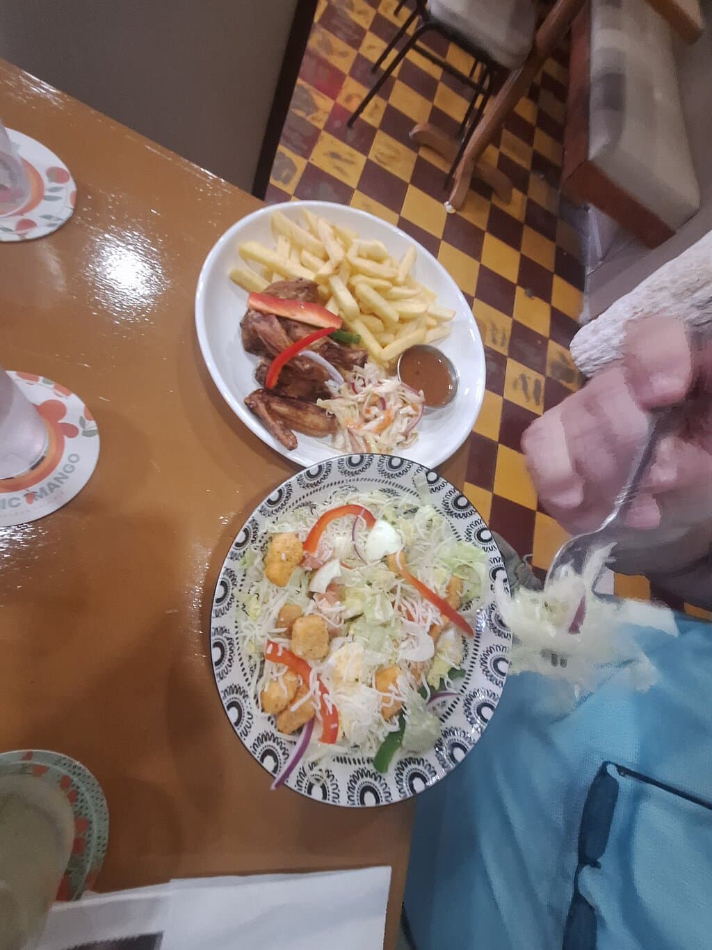 Ceasar salad with a side of chicken wings