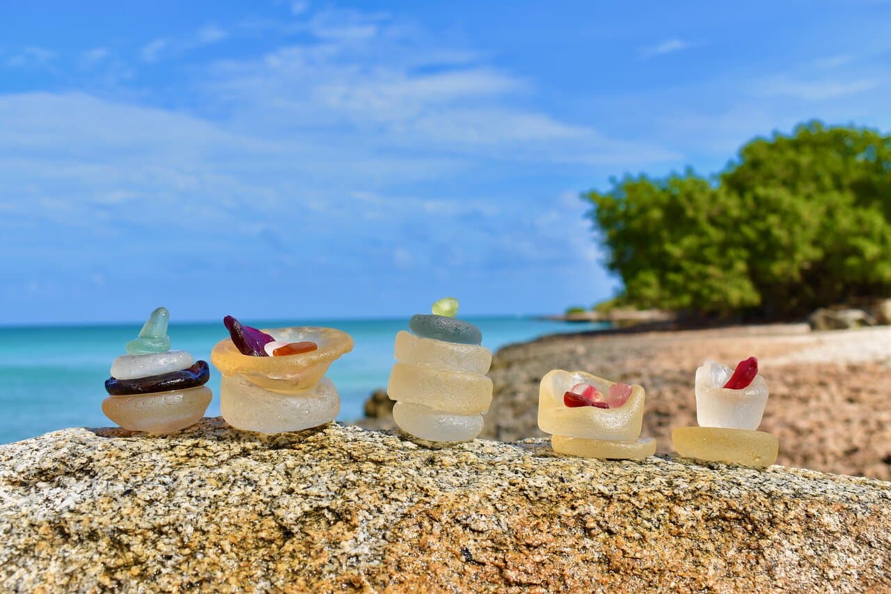 Tour to Sea Glass Island by boat. Our family owned and operated tour company is licensed and insured. We meet all safety standards set by the Aruban Government, so your family can have a worry free experience
