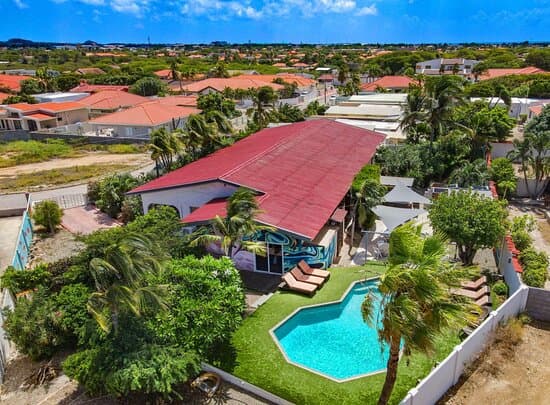 The tropical garden offers a self service bar, terrace with several seats and tables, BBQ areas and a swimming pool with lounge beds. In August we will create a sand patch for games, karate, meditation and yoga.