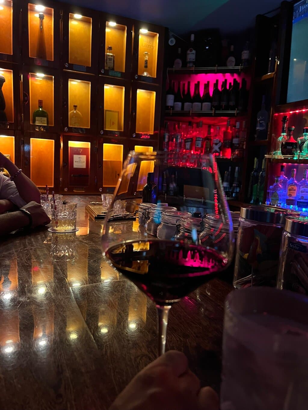 A glass of Merlot in a surprisingly sophisticated lounge